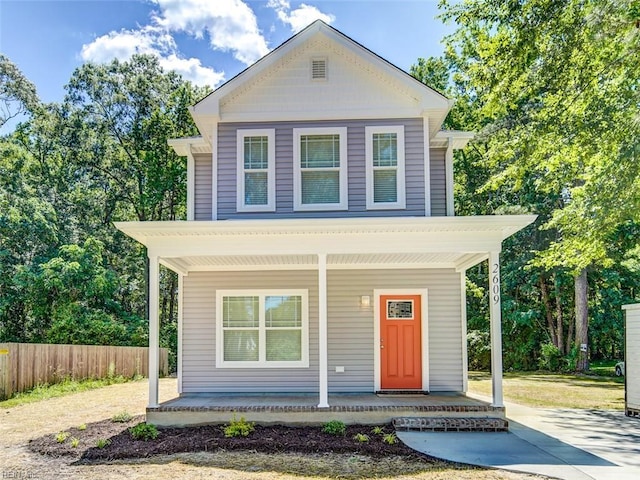 view of front of property featuring a porch and fence