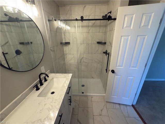 bathroom with a shower stall, vanity, and marble finish floor