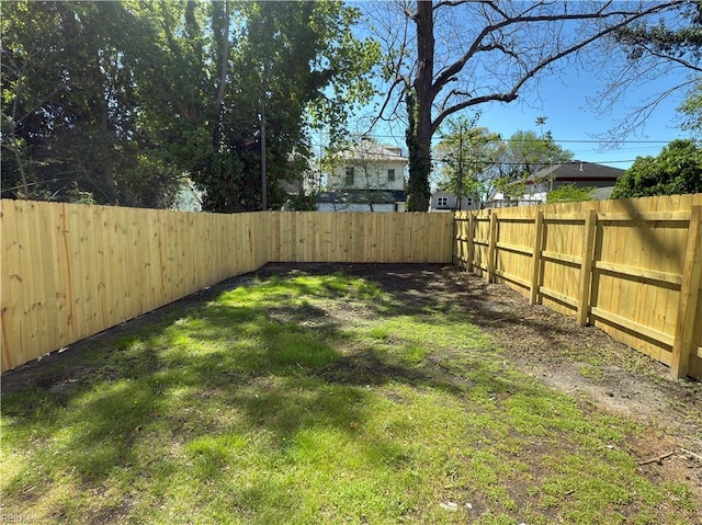 view of yard featuring a fenced backyard