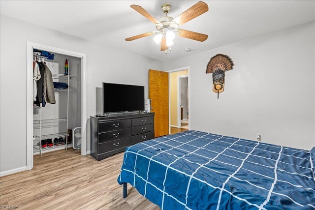 bedroom with a closet, ceiling fan, and wood finished floors