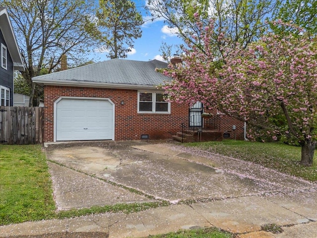 view of side of property featuring concrete driveway, a chimney, brick siding, a garage, and fence
