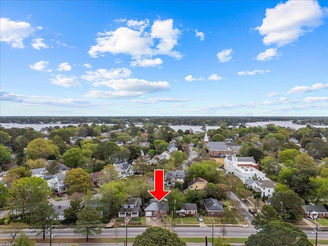 drone / aerial view with a water view and a residential view
