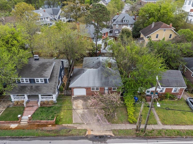 birds eye view of property with a residential view