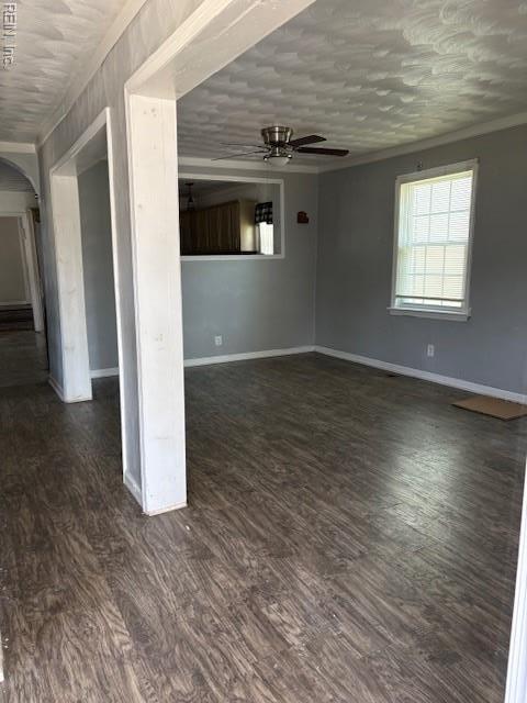 7454 Diven St, Norfolk, VA 23505 - empty room featuring a ceiling fan, arched walkways, crown molding, and dark wood finished floors