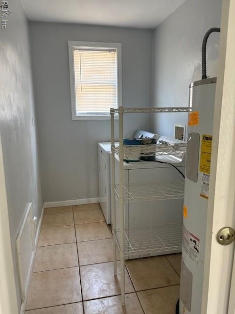 7454 Diven St, Norfolk, VA 23505 - laundry area featuring washer and clothes dryer, water heater, and light tile patterned floors