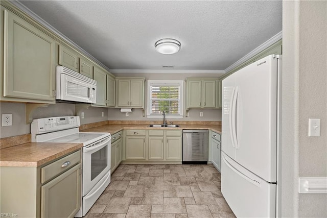 kitchen with white appliances, a textured ceiling, stone finish flooring, light countertops, and a sink
