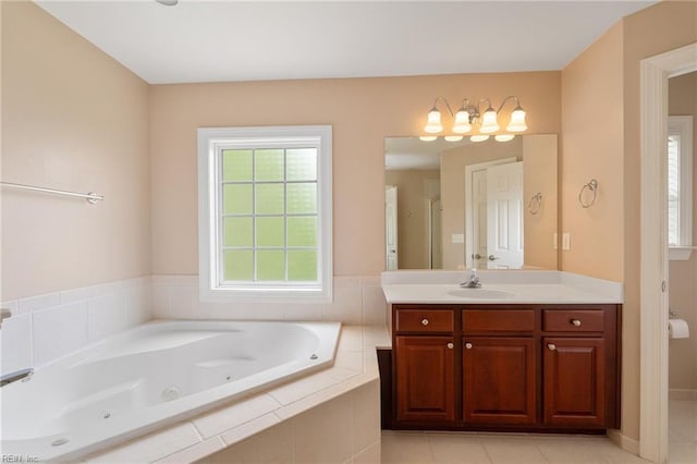 full bath featuring a whirlpool tub and vanity