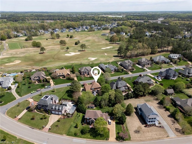 aerial view with view of golf course and a residential view