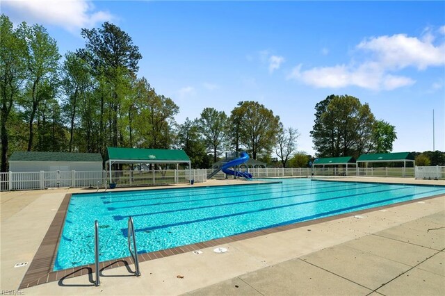 community pool featuring fence