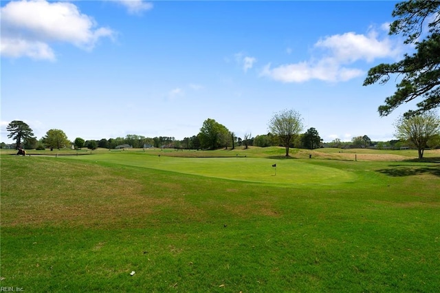 view of property's community with a lawn