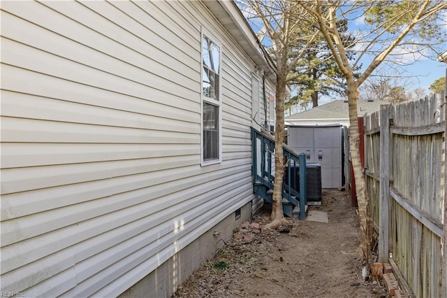 504 Glendale Ave, Norfolk, VA 23505 - view of property exterior with an outbuilding, a shed, central air condition unit, crawl space, and fence