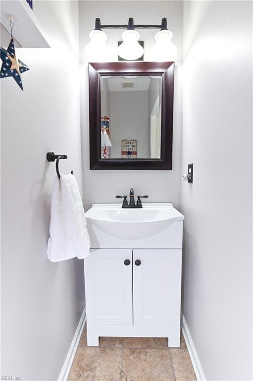 bathroom featuring vanity and baseboards