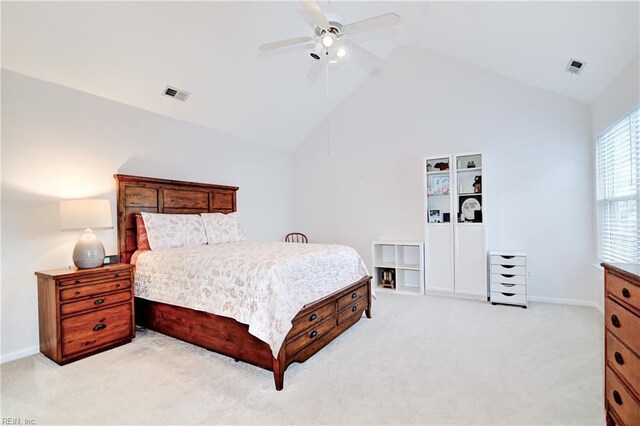bedroom featuring light carpet, visible vents, ceiling fan, and lofted ceiling