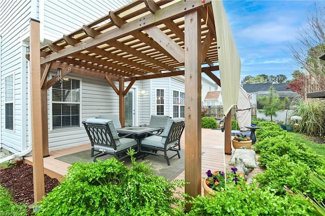 deck featuring fence and a pergola