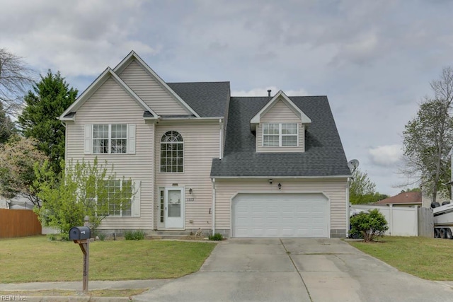 traditional home with a garage, roof with shingles, a front yard, fence, and driveway