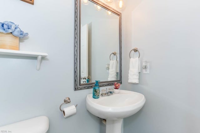 half bath featuring toilet