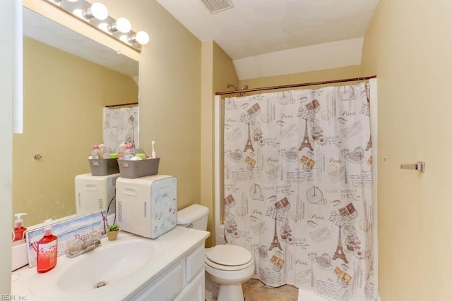 bathroom with visible vents, toilet, a shower with shower curtain, and vanity