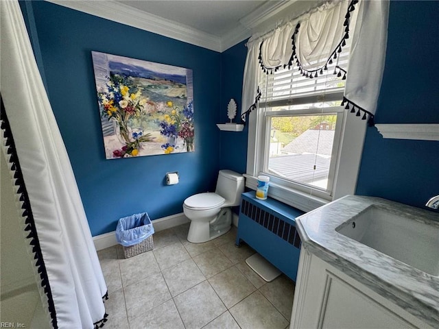 bathroom featuring vanity, tile patterned flooring, crown molding, toilet, and radiator heating unit