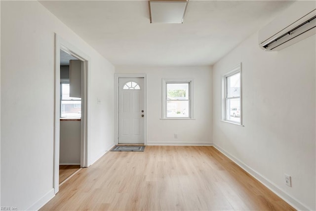 2325 Cottage Ave, Norfolk, VA 23504 - entryway featuring a wall mounted air conditioner, light wood-style flooring, and baseboards