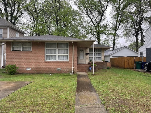646 45th St, Newport News, VA 23607 - view of front of home featuring crawl space, a front yard, fence, and brick siding