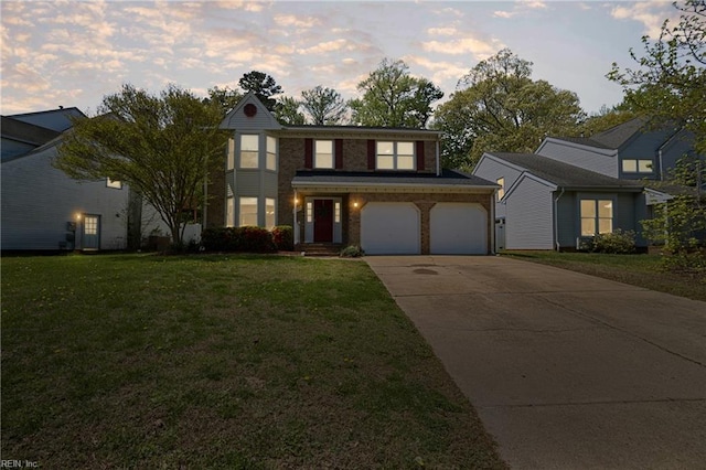 traditional home featuring concrete driveway, a garage, and a front lawn