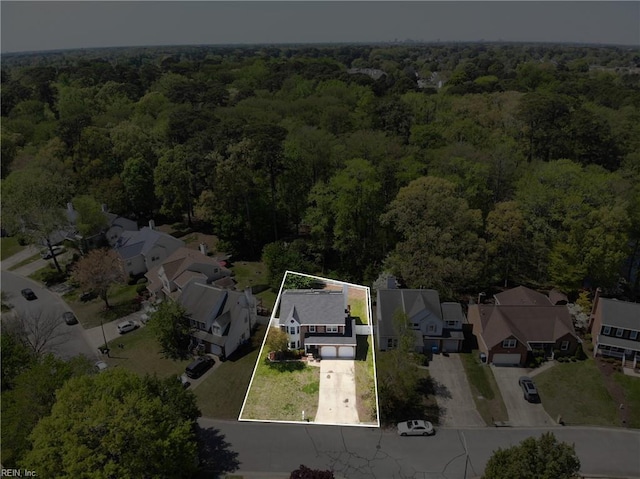 aerial view with a forest view and a residential view