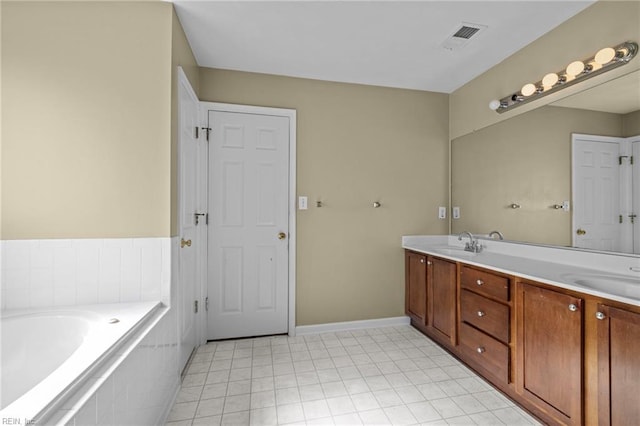 bathroom featuring double vanity, visible vents, a sink, and tiled bath