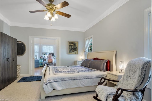 bedroom with carpet flooring, baseboards, ornamental molding, and ceiling fan