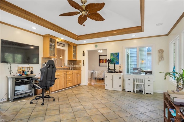 home office with baseboards, ornamental molding, recessed lighting, a ceiling fan, and a raised ceiling