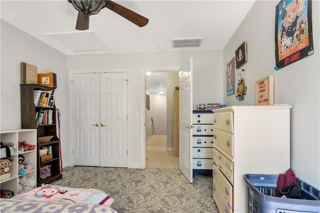 bedroom featuring visible vents, a ceiling fan, a closet, and carpet floors