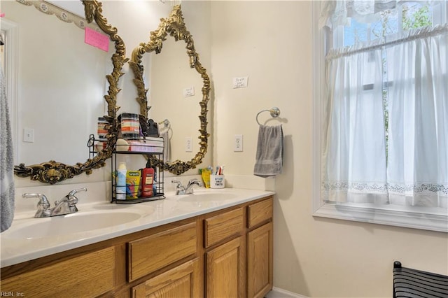 bathroom with double vanity and a sink