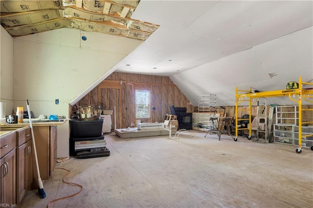 additional living space featuring vaulted ceiling