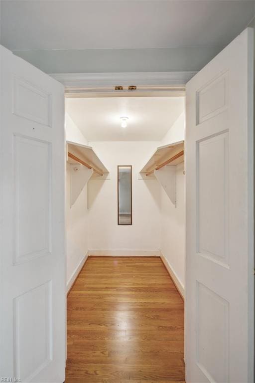 spacious closet with light wood-style floors