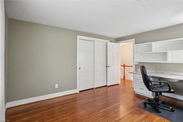 office space featuring dark wood-style floors and baseboards