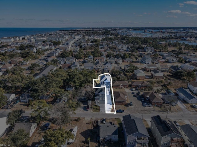birds eye view of property with a residential view and a water view