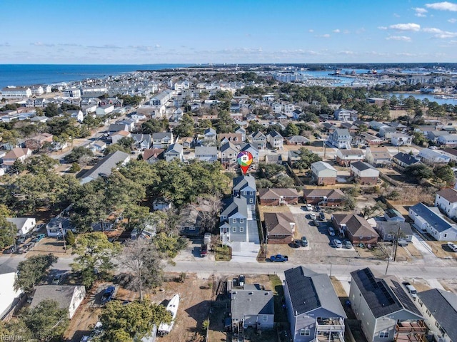 drone / aerial view featuring a water view and a residential view