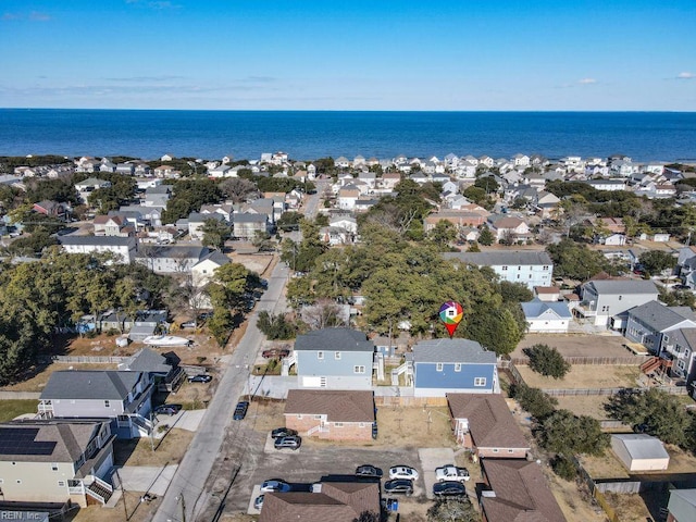 drone / aerial view with a water view and a residential view