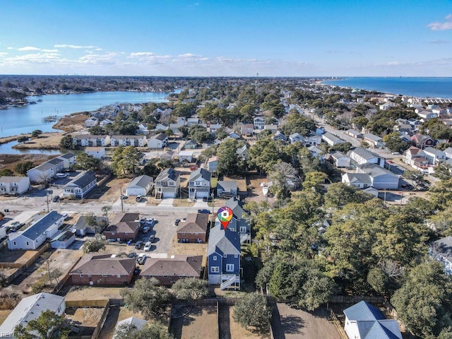 drone / aerial view with a water view and a residential view