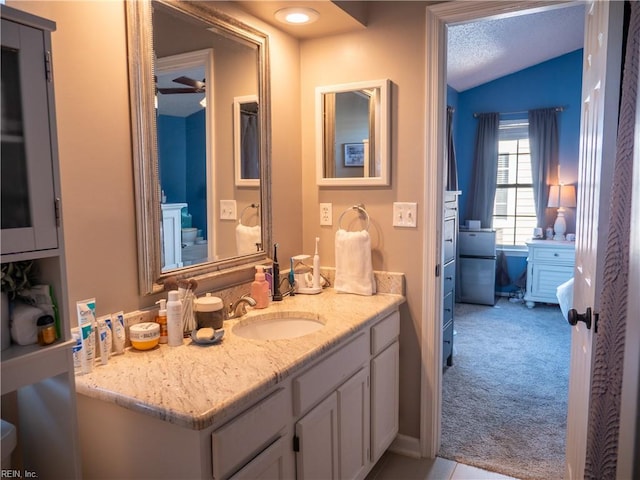 4734 Kempsville Greens Pkwy, Virginia Beach, VA 23462 - bathroom featuring a textured ceiling, vanity, and lofted ceiling