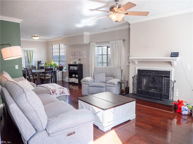4734 Kempsville Greens Pkwy, Virginia Beach, VA 23462 - living area with a textured ceiling, crown molding, a fireplace with raised hearth, ceiling fan, and wood finished floors