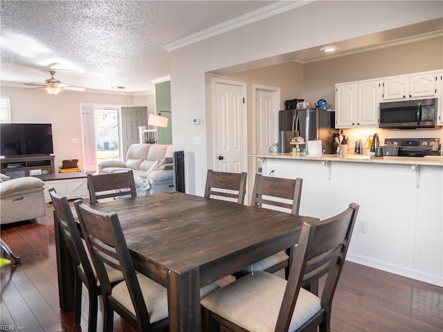 4734 Kempsville Greens Pkwy, Virginia Beach, VA 23462 - dining room featuring crown molding, a healthy amount of sunlight, a ceiling fan, and dark wood-style floors