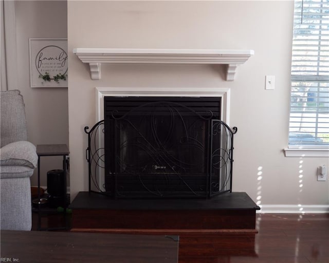 4734 Kempsville Greens Pkwy, Virginia Beach, VA 23462 - room details with baseboards, a fireplace with raised hearth, and wood finished floors