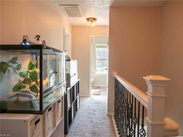4734 Kempsville Greens Pkwy, Virginia Beach, VA 23462 - hall with visible vents, baseboards, an upstairs landing, a textured ceiling, and light colored carpet