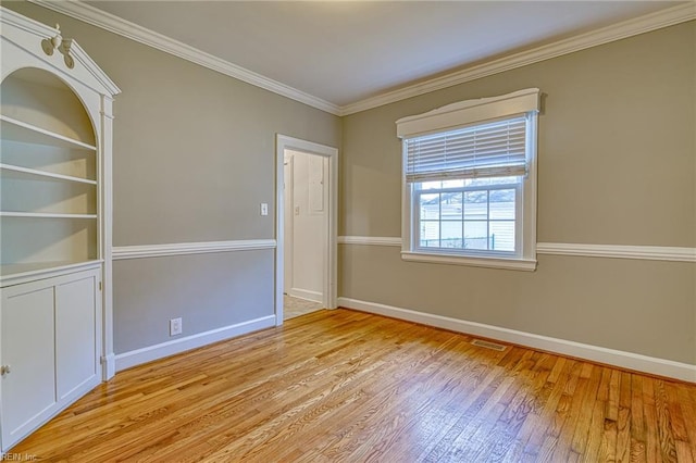217 Hurley Ave, Newport News, VA 23601 - empty room with light wood-style flooring, baseboards, visible vents, and ornamental molding