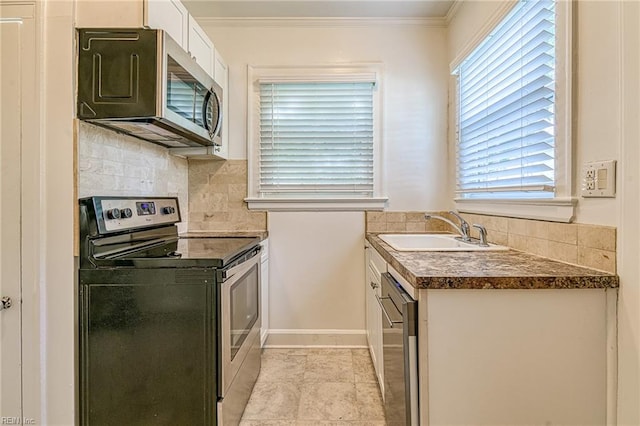 217 Hurley Ave, Newport News, VA 23601 - kitchen featuring tasteful backsplash, white cabinetry, dark countertops, stainless steel appliances, and a sink
