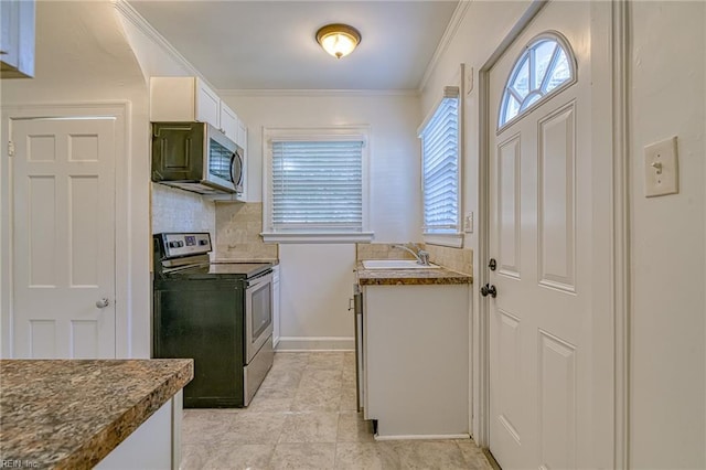 217 Hurley Ave, Newport News, VA 23601 - kitchen featuring tasteful backsplash, ornamental molding, white cabinets, appliances with stainless steel finishes, and a sink