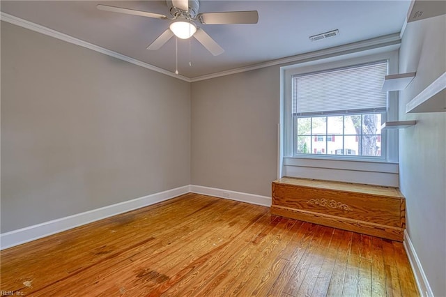 217 Hurley Ave, Newport News, VA 23601 - unfurnished room with visible vents, baseboards, a ceiling fan, light wood-style floors, and crown molding