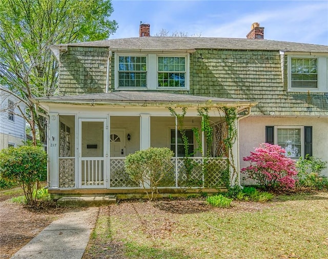 217 Hurley Ave, Newport News, VA 23601 - view of front facade featuring stucco siding, a chimney, and a shingled roof
