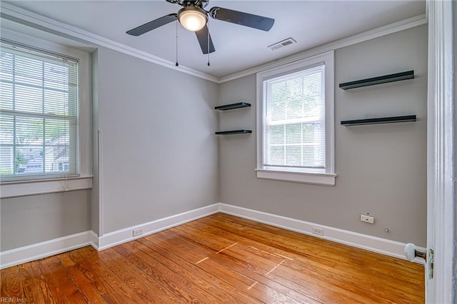 217 Hurley Ave, Newport News, VA 23601 - empty room with crown molding, ceiling fan, visible vents, wood finished floors, and baseboards