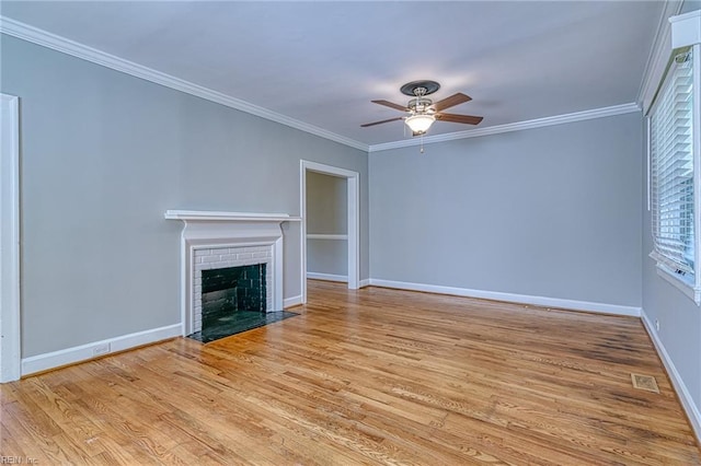 217 Hurley Ave, Newport News, VA 23601 - unfurnished living room with baseboards, a brick fireplace, ornamental molding, a ceiling fan, and wood finished floors